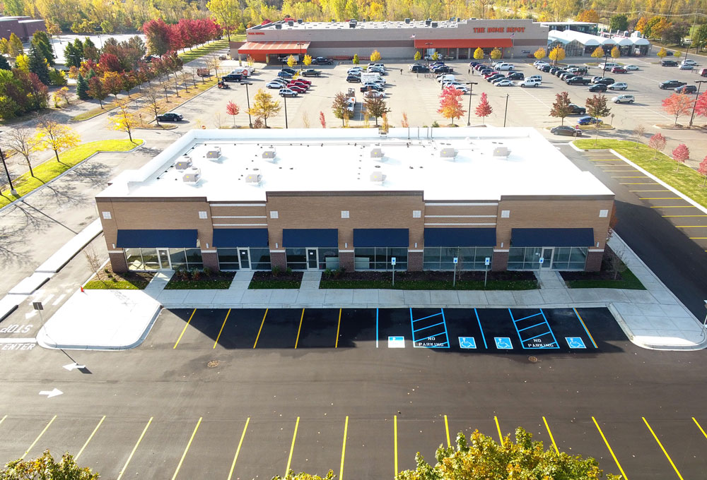 A commercial building and parking lot seen from above, part of an investment sale by Keystone Commercial Real Estate.