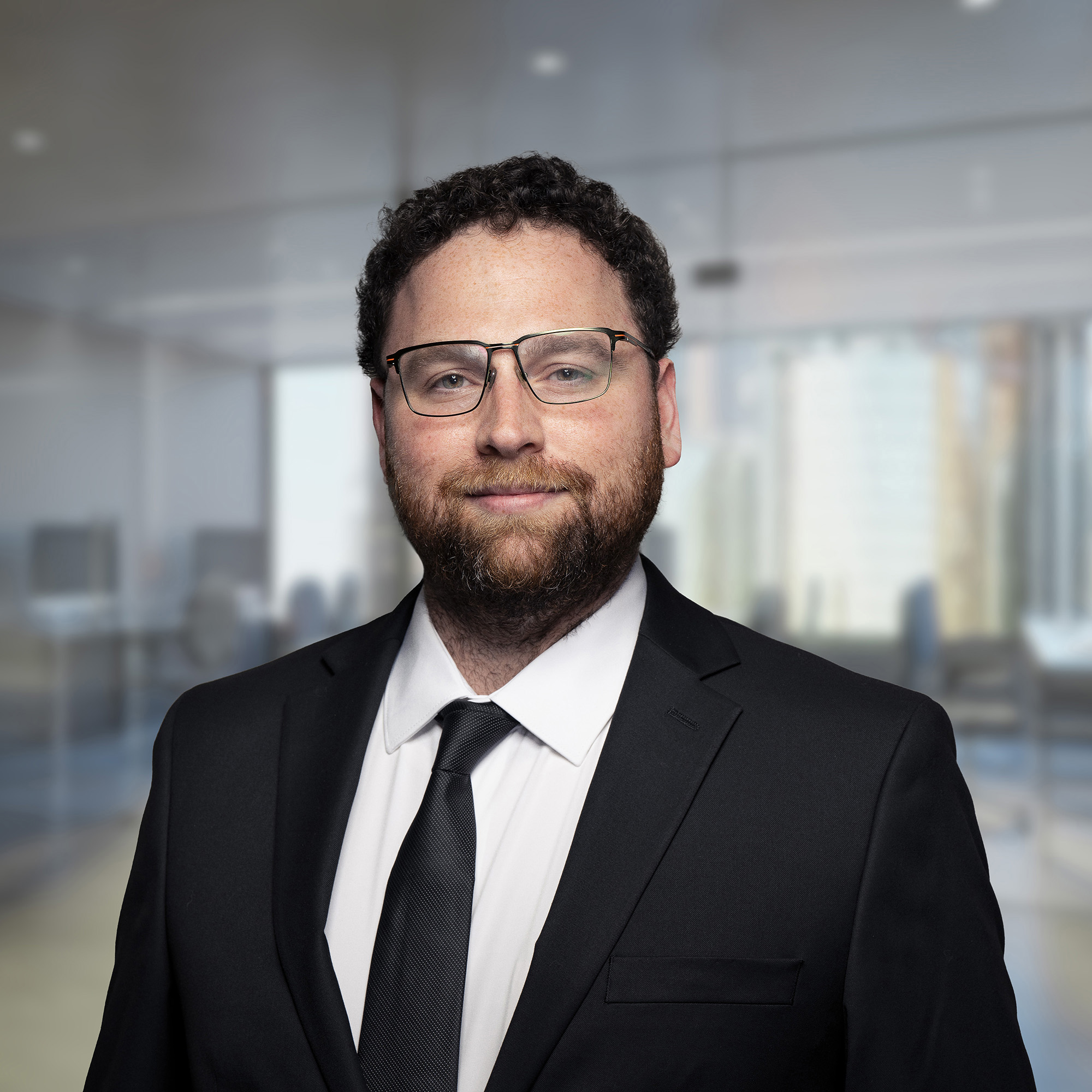 An image of Peter Abro, an advisor at Keystone Commercial Real Estate, in a black suit and blue tie.