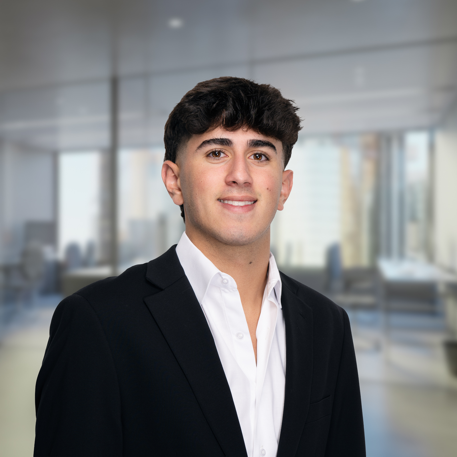 An image of Peter Abro, an advisor at Keystone Commercial Real Estate, in a black suit and blue tie.
